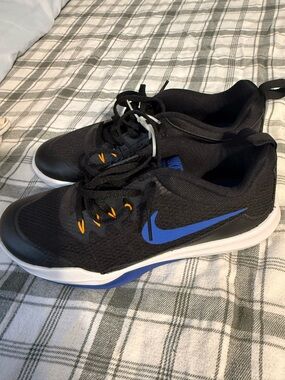 Nike Men’s Black Athletic Shoes with Blue Swoosh and Orange Eyelets